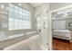 Bathroom walk-in shower, glass block window, with a view to the main bedroom at 1308 Divot Ct, Mount Pleasant, SC 29466