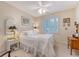 Bright bedroom featuring white furniture, neutral walls, and a window with plantation shutters at 1308 Divot Ct, Mount Pleasant, SC 29466