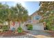 Beautiful home with well-maintained landscaping, a multi-car garage, and a charming front porch at 1308 Divot Ct, Mount Pleasant, SC 29466