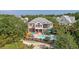 Home aerial view with pool, outdoor seating, lush greenery, and meticulously kept grounds at 1308 Divot Ct, Mount Pleasant, SC 29466