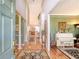 Grand foyer with hardwood floors, high ceilings, decorative columns, and a glimpse into the living areas at 1308 Divot Ct, Mount Pleasant, SC 29466
