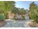 Charming home featuring a circular driveway, well-manicured landscaping, and a two-car garage at 1308 Divot Ct, Mount Pleasant, SC 29466