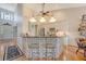 Open-concept kitchen with brick island, breakfast bar seating, and modern appliances and fixtures at 1308 Divot Ct, Mount Pleasant, SC 29466