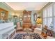 Cozy living room featuring a white piano, comfortable seating, and classic decor with natural light at 1308 Divot Ct, Mount Pleasant, SC 29466