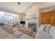 Cozy living room features a fireplace, built-in shelving, a plush sofa, and abundant natural light at 1308 Divot Ct, Mount Pleasant, SC 29466