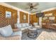 Cozy outdoor patio with lattice, comfortable seating, ceiling fan, perfect for relaxing and entertaining at 1308 Divot Ct, Mount Pleasant, SC 29466