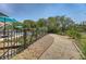 Resort style backyard with pool, beautiful landscaping, and stone pathway to the nature preserve at 1308 Divot Ct, Mount Pleasant, SC 29466