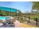 Relaxing pool area with outdoor seating, lush landscaping, and a marsh view at 1308 Divot Ct, Mount Pleasant, SC 29466