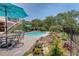 Backyard patio and pool area with outdoor seating and beautiful green foliage at 1308 Divot Ct, Mount Pleasant, SC 29466