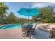 Relax poolside in this private backyard oasis with ample seating and landscaping at 1308 Divot Ct, Mount Pleasant, SC 29466