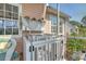 Porch with white railing and a view of the surrounding landscape and neighborhood at 1308 Divot Ct, Mount Pleasant, SC 29466