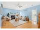 Cozy living room features hardwood floors, a fireplace, and blue walls creating a relaxing atmosphere at 1458 Clarendon Way, Mount Pleasant, SC 29466
