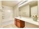 Bright bathroom featuring a large mirror, updated vanity, and a shower-tub combination at 149 Woodward Rd, Goose Creek, SC 29445