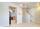 Open-concept dining room with modern chandelier and a view into the kitchen with black refrigerator at 149 Woodward Rd, Goose Creek, SC 29445