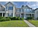 Charming home with manicured lawn, walkway, and classic architectural details at 149 Woodward Rd, Goose Creek, SC 29445