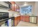 This bright kitchen is complete with updated stainless steel appliances and light countertops at 149 Woodward Rd, Goose Creek, SC 29445