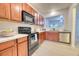 Updated kitchen featuring stainless steel appliances, wood cabinets and pass through window to the dining area at 149 Woodward Rd, Goose Creek, SC 29445