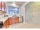 Spacious kitchen featuring wood cabinets, stainless appliances and a pass through window to the living area at 149 Woodward Rd, Goose Creek, SC 29445