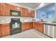 Updated kitchen with wood cabinets, stainless steel appliances, sink, and great natural light at 149 Woodward Rd, Goose Creek, SC 29445