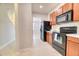 Well-lit kitchen boasts stainless steel appliances, wood cabinets and lots of counter space at 149 Woodward Rd, Goose Creek, SC 29445