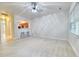 Bright living room features bar seating to the kitchen, light walls, hardwood floors, and a ceiling fan at 149 Woodward Rd, Goose Creek, SC 29445