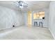 Bright living room features bar seating to the kitchen, and light walls, with hardwood floors and white trim at 149 Woodward Rd, Goose Creek, SC 29445