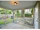 This screened porch offers a view of the fenced backyard, with an access door and concrete flooring at 149 Woodward Rd, Goose Creek, SC 29445