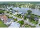 An aerial view of a neighborhood featuring a beautiful lake and lovely homes surrounded by lush greenery at 1597 Rivertowne Country Club Dr, Mount Pleasant, SC 29466
