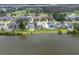 Aerial view of waterfront homes, showing their placement on a river and the proximity to the golf course at 1597 Rivertowne Country Club Dr, Mount Pleasant, SC 29466