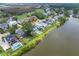 Waterfront property with aerial view showcasing a well-manicured lawn, a swimming pool, and beautiful lake at 1597 Rivertowne Country Club Dr, Mount Pleasant, SC 29466