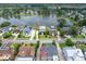 An aerial view of a neighborhood featuring a beautiful lake and lovely homes surrounded by lush greenery at 1597 Rivertowne Country Club Dr, Mount Pleasant, SC 29466