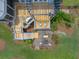 Aerial view of multi-tiered deck, outdoor kitchen, dining area, and fire pit, perfect for relaxing or entertaining at 1597 Rivertowne Country Club Dr, Mount Pleasant, SC 29466