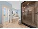 A clean designed bathroom features a sleek shower, a soaking tub and an abundance of natural light at 1597 Rivertowne Country Club Dr, Mount Pleasant, SC 29466