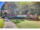 Inviting entrance to Rivertowne Country Club features brick columns, lush landscaping, and a welcoming stone sign at 1597 Rivertowne Country Club Dr, Mount Pleasant, SC 29466