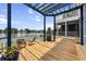 Beautiful waterfront deck with outdoor furniture and a stunning lake view at 1597 Rivertowne Country Club Dr, Mount Pleasant, SC 29466