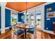 Dining nook with views of the water, wood floors, and contemporary chandelier at 1597 Rivertowne Country Club Dr, Mount Pleasant, SC 29466
