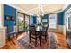 Charming dining room featuring hardwood floors, a chandelier, and a view of the backyard at 1597 Rivertowne Country Club Dr, Mount Pleasant, SC 29466