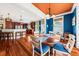 Open-concept dining room and kitchen featuring hardwood floors and custom cabinetry at 1597 Rivertowne Country Club Dr, Mount Pleasant, SC 29466