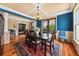 Formal dining room with hardwood floors, colorful walls, and a stylish chandelier at 1597 Rivertowne Country Club Dr, Mount Pleasant, SC 29466