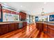 Open kitchen with granite countertops, stainless steel appliances, and hardwood flooring at 1597 Rivertowne Country Club Dr, Mount Pleasant, SC 29466