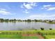 Scenic lake view showcasing the expansive water feature and surrounding homes at 1597 Rivertowne Country Club Dr, Mount Pleasant, SC 29466