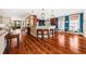 Open living space with hardwood floors connecting to the kitchen and dining areas at 1597 Rivertowne Country Club Dr, Mount Pleasant, SC 29466