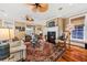 Elegant living room featuring a fireplace, hardwood floors, and ample natural light at 1597 Rivertowne Country Club Dr, Mount Pleasant, SC 29466