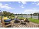 Inviting outdoor patio with elegant furniture, lush landscaping, and scenic waterfront views at 1597 Rivertowne Country Club Dr, Mount Pleasant, SC 29466