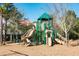 Community playground features slides and a covered play structure, set in a safe area for enjoyment at 1597 Rivertowne Country Club Dr, Mount Pleasant, SC 29466
