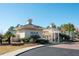 Community pool entrance featuring pergola, manicured landscaping, and secure gated access for residents' enjoyment at 1597 Rivertowne Country Club Dr, Mount Pleasant, SC 29466