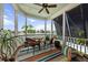 Relaxing screened porch with lake view and comfortable seating area at 1597 Rivertowne Country Club Dr, Mount Pleasant, SC 29466