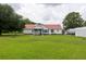 Spacious backyard with a screened in porch and a well-manicured lawn at 160 Syrr Run Rd, Saint George, SC 29477