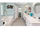 Bright bathroom features double sink vanity, decorative mirrors, and a soaking tub at 160 Syrr Run Rd, Saint George, SC 29477