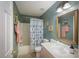 Traditional bathroom features a tub-shower combo, toilet, and vanity with decorative gold framed mirror at 160 Syrr Run Rd, Saint George, SC 29477